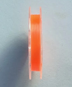 Sunline Tenjo line spool showing bright orange color.