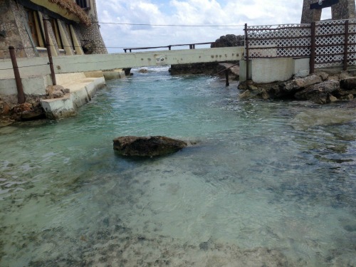 Channel from the sea with a rock in the middle of the channel.