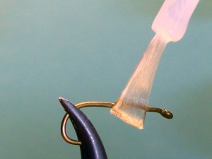 Touching hook with super glue on brush applicator