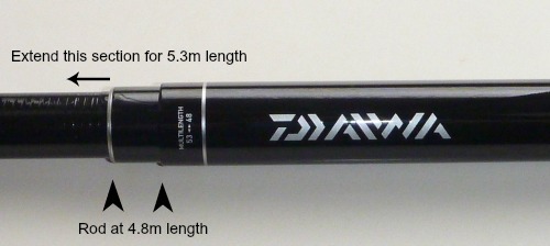 Photo showing Daiwa 53MF with the zooming section collapsed. Text on the photo says "Extend this section for 5.3m length. It also has two arrows showing the rod at the 4.8m length.