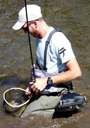 Daniel Galhardo with trout in net