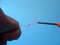 Figure 8 knot in the line formed by hooking the loop tag end and pulling it back through the loop.
