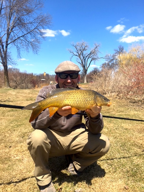AAron B holding carp he caught with Flying Dragon