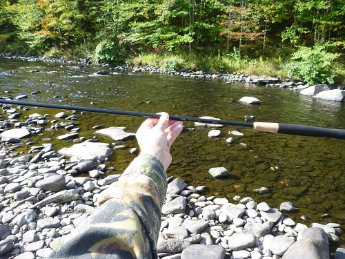 Angler holding collapsed 44NP at arms length