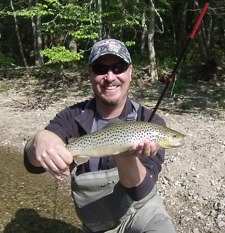 Angler holding brown trout