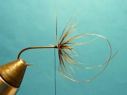 Copper wire tied in behind hackle