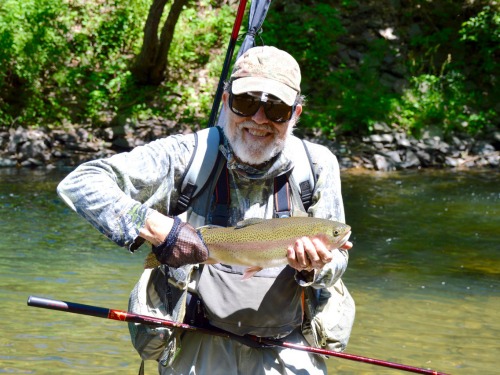 Angler holding a nice rainbow trout