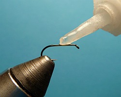 Step 1 Hook in vise. Touch hook shank with super glue