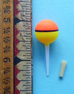 5/8" Nakazima Ball Float alongside ruler for scale
