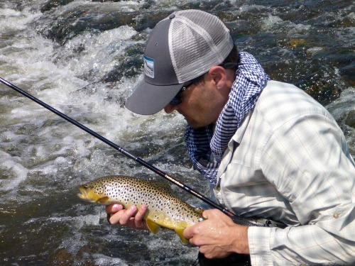 Rob Worthing holding brown trout and TenkaraBum 40