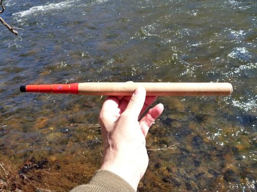 Angler holding collapsed Tenryu Furaibo TF39TA tenkara rod