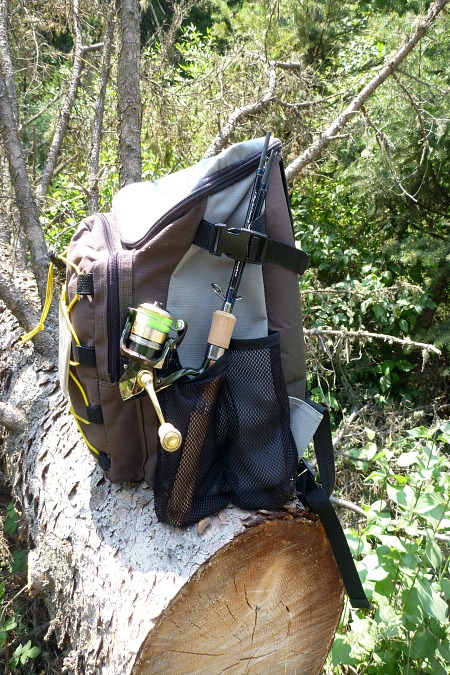 Backpack with spinning rod in side pocket