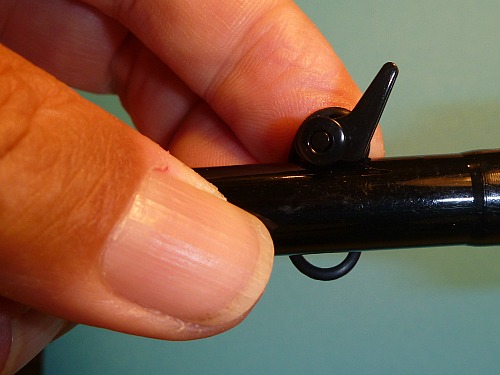 View from the side, showing end of O ring hanging below horizontal rod