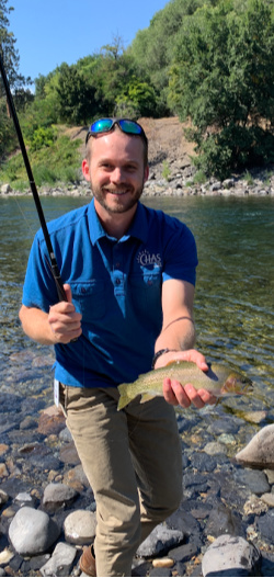 Angler holding cutthroat trout