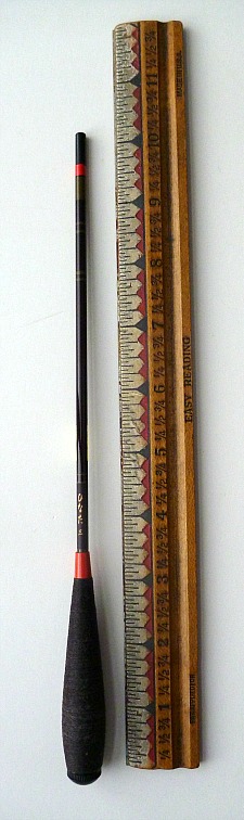 Collapsed Daiwa Hinata with ruler for scale. Collapsed rod is about 10 inches long.