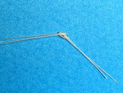 Initial knot to keep hair together before twisting.