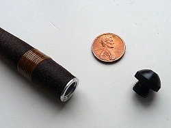 Grip screw cap with penny for scale.