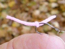 Overhand Worm fly lightly stuck in angler's finger