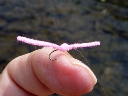 Overhand Worm on angler's finger