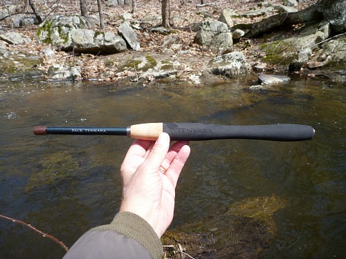 Angler holding collapsed Pack Tenkara