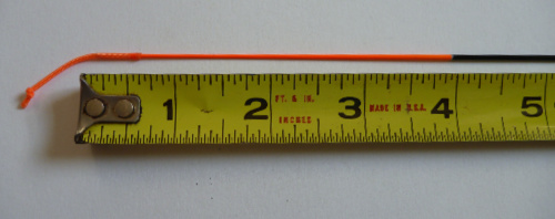 Rod tip showing lillian, with ruler for scale. The last four inches of the rod is painted orange.