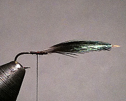 Starling Feather tied in by the heather stem