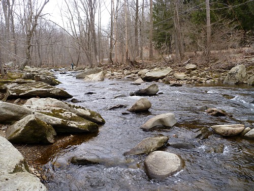 Small rocky stream on a gray winter day