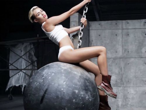 Slide: Photo of Miley Cyrus sitting on a wrecking ball